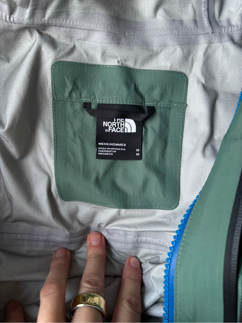 The North Face Men’s Waterproof Hooded Rain Jacket — Sage Green with Blue Zipper
